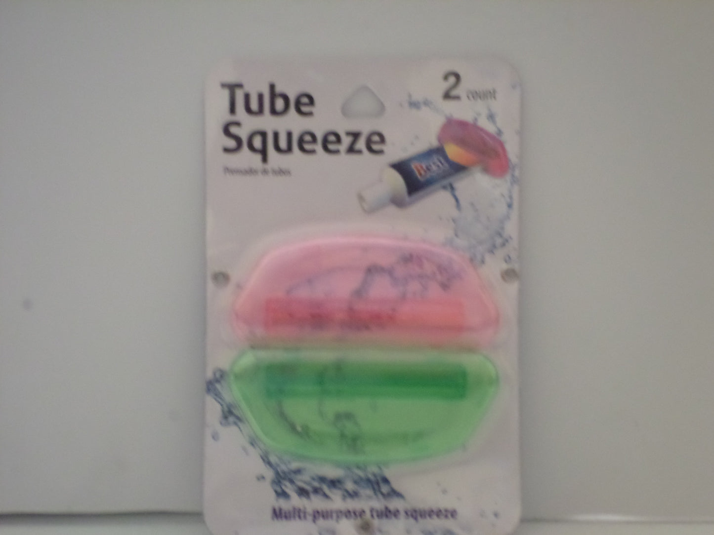 two pack pink and green tooth paste squeezer